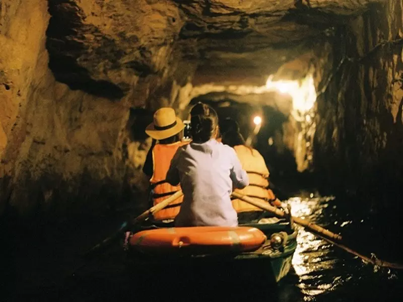 Explore caves at Trang An