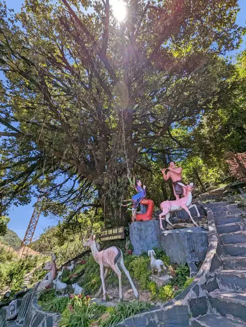 Five colorful statues of female deities holding peaches, located at Sapa Heaven Gate