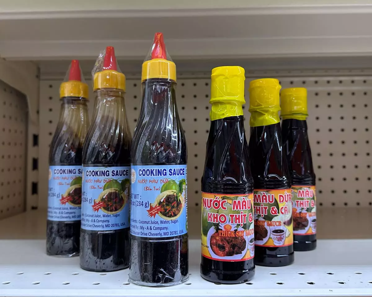 4 different bottles of fish sauce: red boat brand, three crabs brand, squid brand, and aroy-d premium brand.